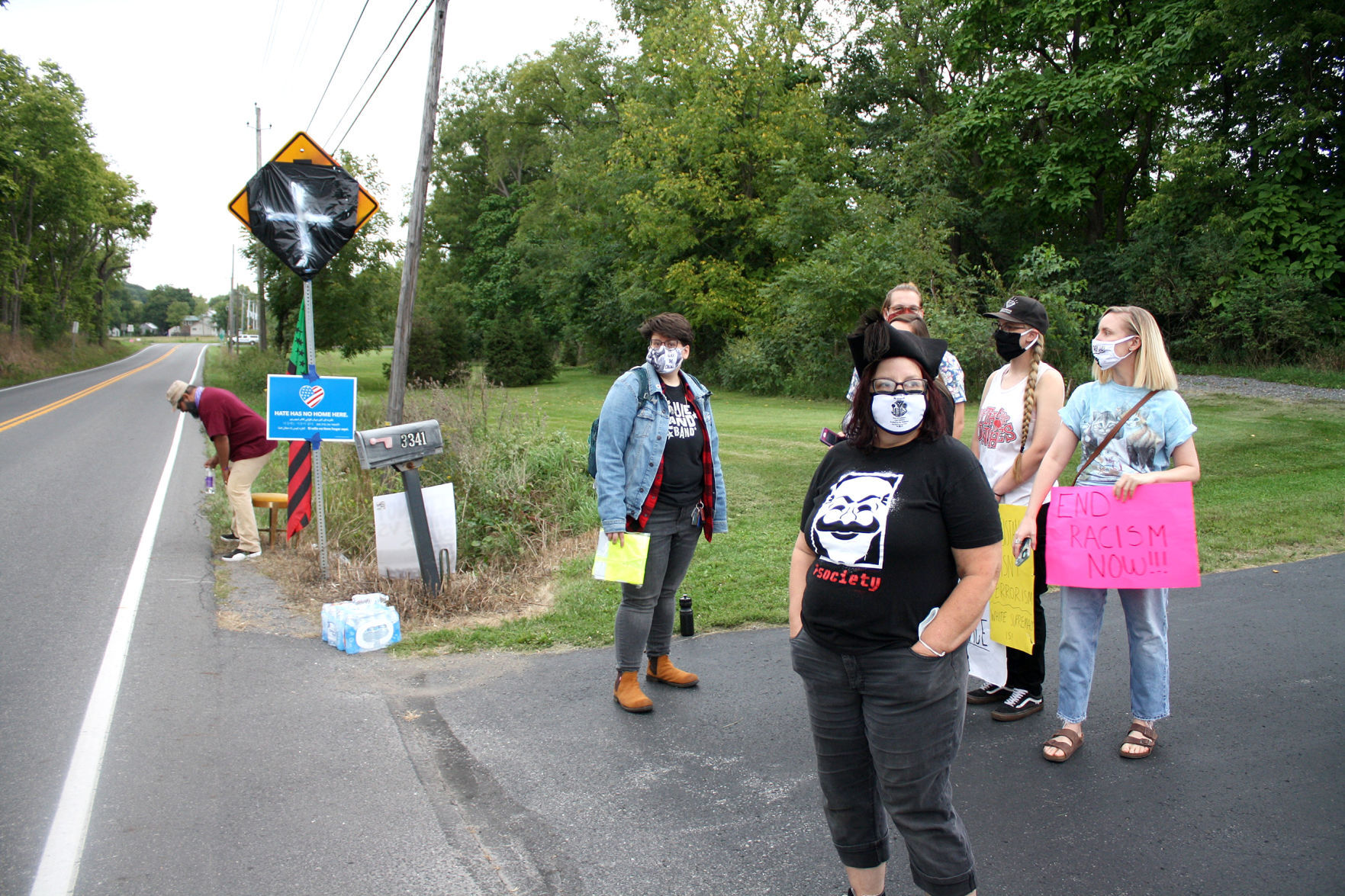 ‘Pop up’ protest at defaced road sign